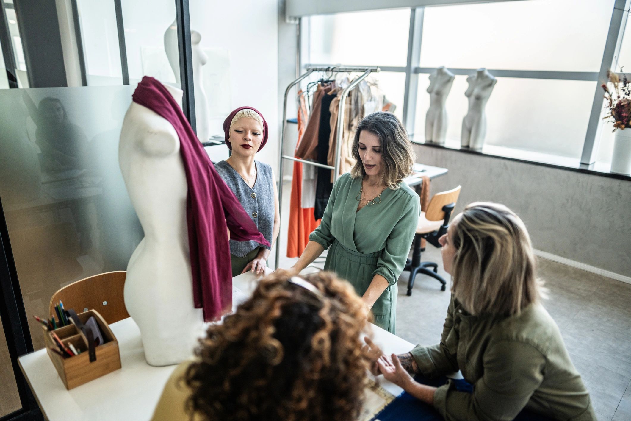 Tailors working together in a studio atelier